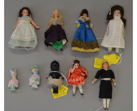 A small group of Bisque Dolls House dolls together with other items which include a modern handmade Peg Doll and a celluloid 