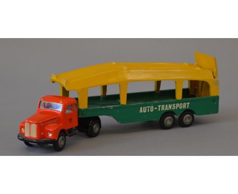 An unboxed Tekno No. 431 Sania Vabis  'Auto-Transport' Car Transporter with orange tractor unit and green/yellow back, appear