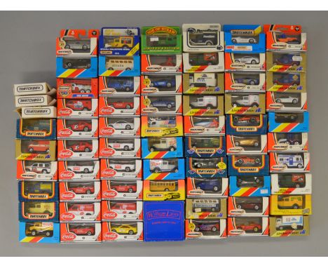 A good quantity of  boxed small scale Matchbox diecast models, including fourteen 'Coca-Cola' branded vehicles. All appear VG
