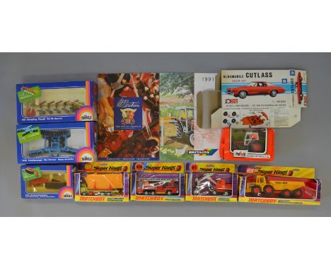 Box of 8 assorted die cast. Polistil tractor, Siku rotary mower, Siku plough, Siku disc harrow, Matchbox tractor and trailer,