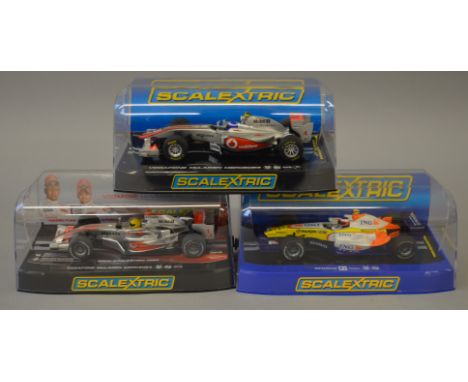 3 x Scalextric cars. C2781 Renault F1 2007 No 4. C3166 Vodafone McLaren Mercedes Jenson Button No4 2011. C2985 McLaren MP4-21