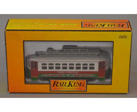 O Gauge MTH Rail King (USA) Christmas Bump-n-Go Trolley. 3-rail G/VG boxed.
