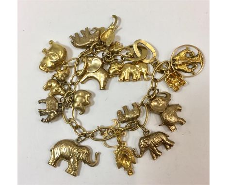 Vintage mixed Gold charm bracelet. Elephant charms hallmarked 9 carat and 18 carat. Bracelet hall marked 750 total weight 51.