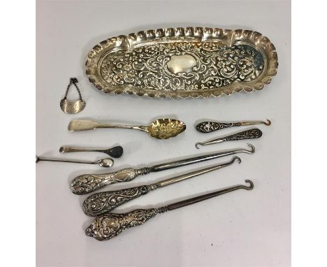 Collection of Silver items includes Silver pin tray, button hooks small Whiskey label ect total weight of items approx 216g