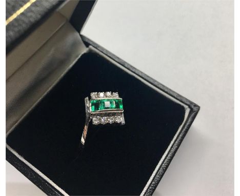 18ct White Gold Diamond & Emerald Ring faintly marked 18k 3 emeralds set with 4 small diamonds each side 