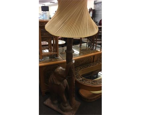 Heavily carved elephant design wooden standard lamp, approx measurements: Height 71 Inches.