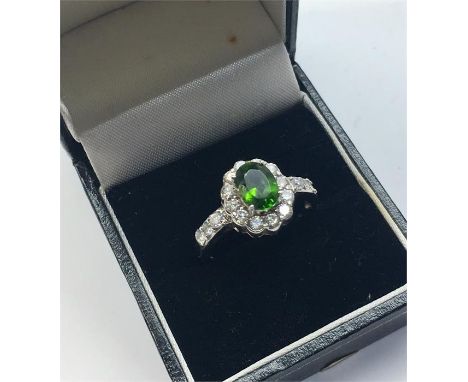 14ct White Gold Dress Ring set with green and white stones total weight of ring 4.5g