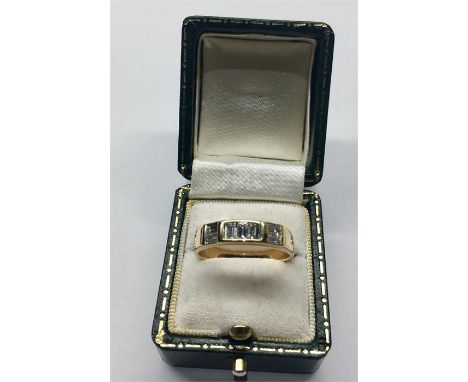 18ct Gold & Baquette Diamond Ring hallamrked 750 set with 7 Baguette Diamonds centre each measure approx 3.5mm by 3mm weight 