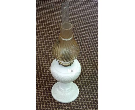A white milk glass oil lamp