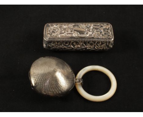 A floral embossed Silver box, Birmingham 1901 and a Silver and Mother of Pearl teething ring, Birmingham 1929