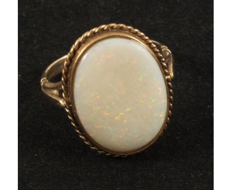 A 9ct Gold ring set with a large Opal, size O