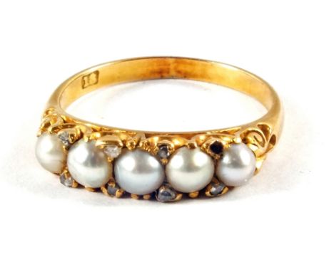 An 18ct Gold Pearl and Diamond set ring (one Diamond missing), size O