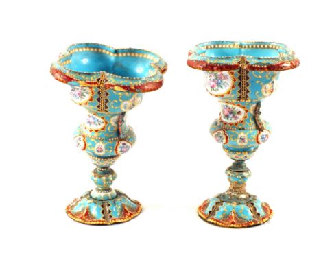 A pair of 19th Century French blue ground enamel vases with finely painted gilt and floral decoration (some damage and restor