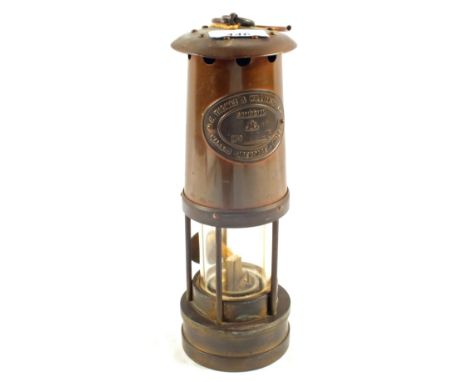 A Brass miner's lamp by E.Thomas and Williams Ltd, Aberdare, comes with three Brass colliery tags