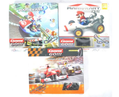 A collection of x3 boxed Carrera Go 1/43 scale Scalextric type slot car racing sets comprising Nintendo ' Mario 8 ' with Mari