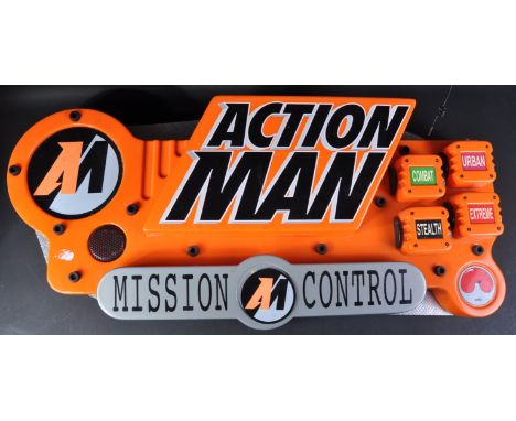 A vintage ex-toyshop Action Man ' Mission Control ' advertising display sign. Orange plastic construction with various faux b