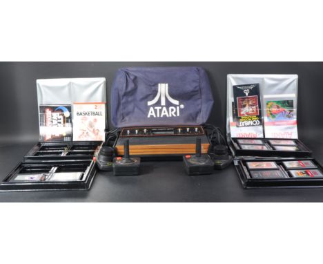 Retro Gaming - an Atari 2600 video games console and ten games cartridges to comprise of; Tennis, Game Program Combat CX-2601