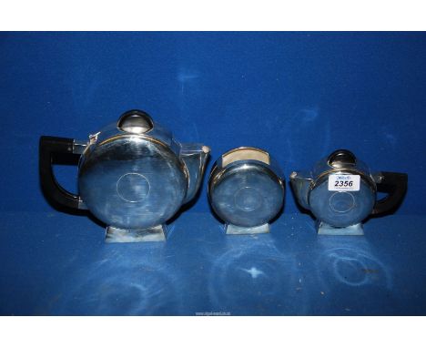 A three piece white metal Art Deco style tea set, teapot, jug, sugar, very heavy.