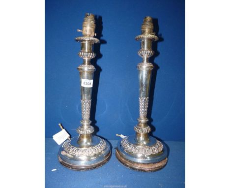 A pair of Silver candlesticks, Birmingham 1809, maker 'MB' Matthew Boulton, converted into table lamps. Base of one a/f. 13 1