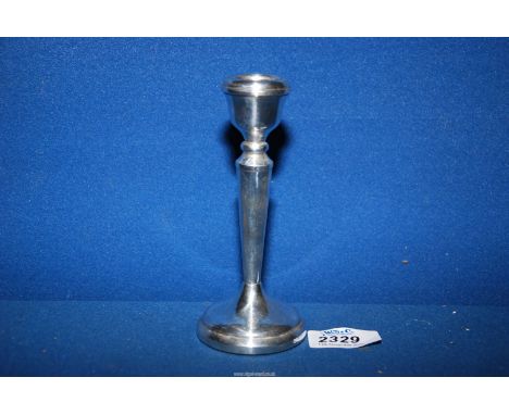 A Silver candlestick with weighted base, Birmingham 1978, makers Pinder brothers, 5 1/2'' tall.