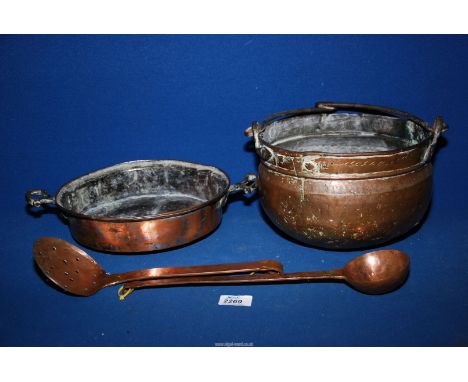 Four copper items;  pan with brass handles, cooking pot, ladle and slotted spoon.
