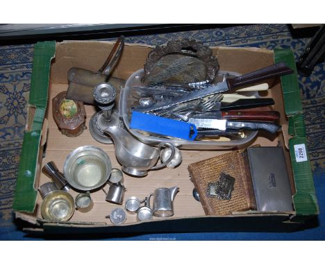 A quantity of silver plated items to include;  cigarette box, candlestick, milk jug, quantity of small jugs, cutlery and brea