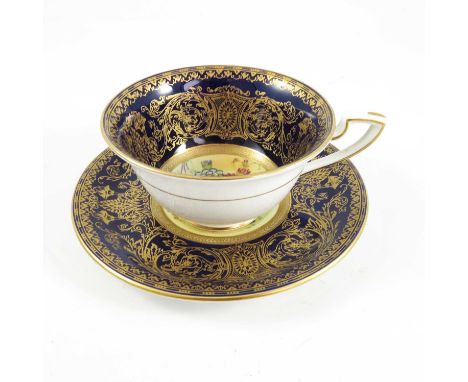 ROYAL WORCESTER CABINET CUP AND SAUCER BLUE AND GILT WITH FLOWER DECORATION SIG E BARKER