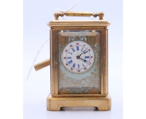 A Sevres style miniature carriage clock with key.  5.5 cm high. 