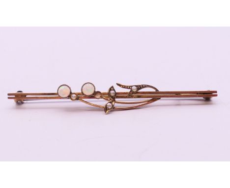 A 9 ct gold, opal and seed pearl bar brooch.  6 cm wide. 