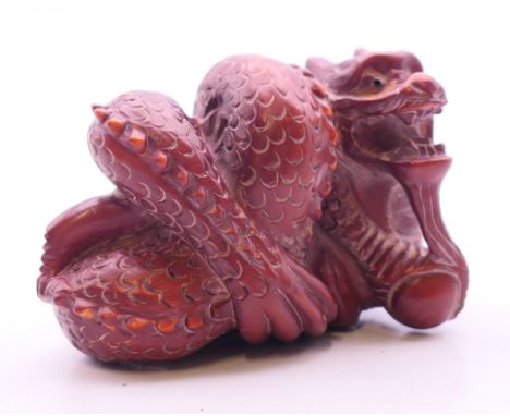A netsuke formed as a dragon.  5.5 cm wide.