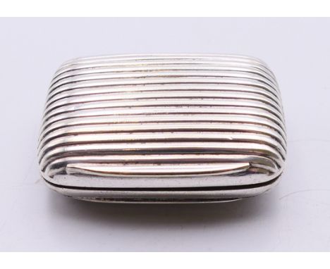 A 19th century silver-plated reeded decorated snuff box with gilded interior.  4 x 5.5 cm. 