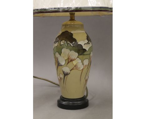 A Moorcroft pottery table lamp with silk shade. 48.5 cm high.