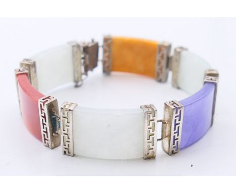 A Chinese multi-coloured jade bracelet set in silver. 18 cm long. 