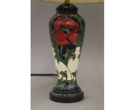 A Moorcroft pottery table lamp with silk shade. 49 cm high.