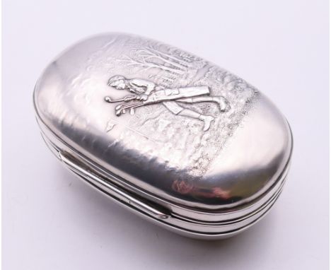 An American silver box, the lid embossed with a caddy carrying golf clubs on a golf course, marked Sterling, 925 Fine, with g