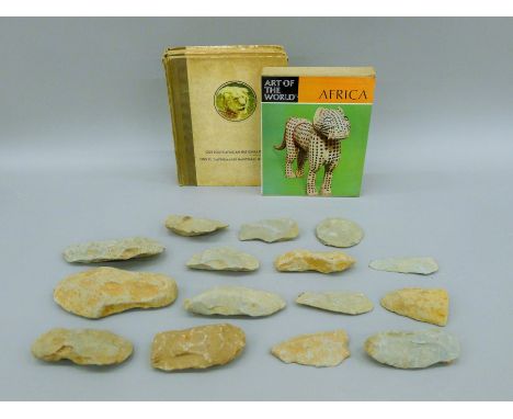 A quantity of stone axe heads (the largest 18 cm long) and three books pertaining to Africa.