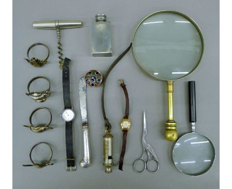 A quantity of miscellaneous items, including a magnifying glasses, watches, corkscrew, etc. The largest 23.5 cm high.