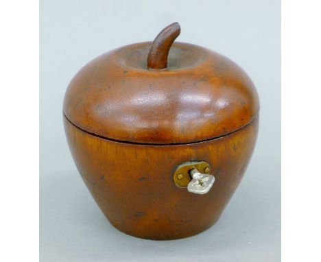 A wooden tea caddy formed as an apple. 11.5 cm high.