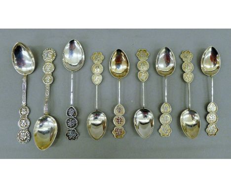 A quantity of Chinese silver teaspoons. The largest 12 cm long. 74.5 grammes.