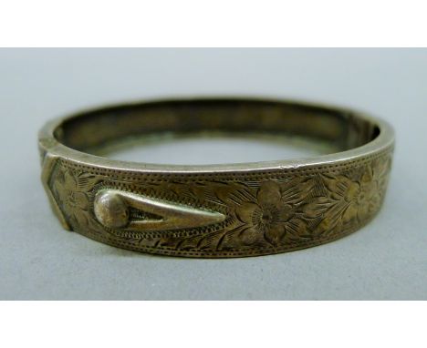 A silver bangle-form bracelet. 6 cm inner diameter. 