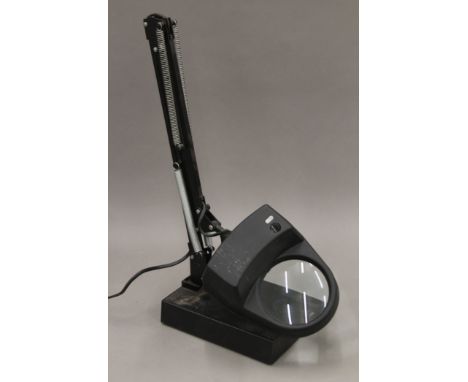 A Luxo anglepoise magnifying lamp. 13 cm wide.