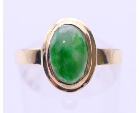 A 14 K gold jade ring. Ring size P/Q. 