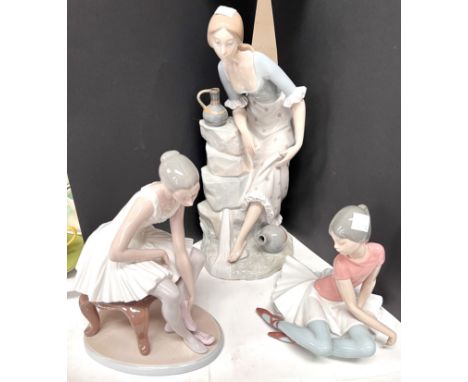 A large Lladro style figure of a seated woman; a Lladro seated ballerina a similar Nao figureThe 3 figures appear to be in go