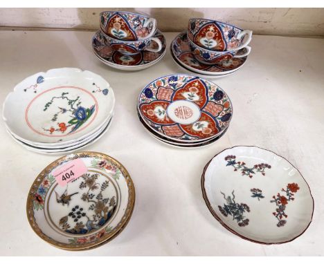 A selection of Japanese tea ware with cups, saucers etc., with gilt highlights and traditional decoration. 