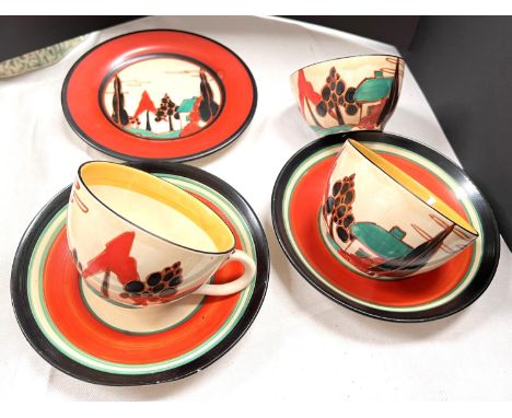 A pair of Clarice Cliff Fantasque 'House and Trees' cups and saucers, with rounded handles and bodies, a matching sugar bowl 