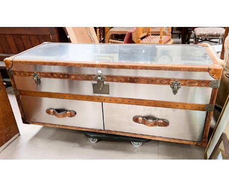 A Timothy Oulton style designer 'steamer trunk' long low chest of brushed steel with tan leather bindings with studded decora