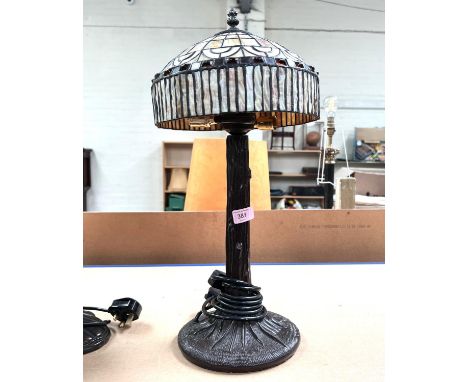 A Tiffany lamp with bark effect column, rounded shade 