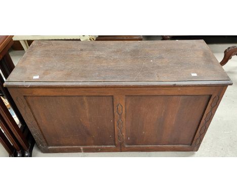 A carved oak bedding chest with panel front, length 91cm; a small oak chest 