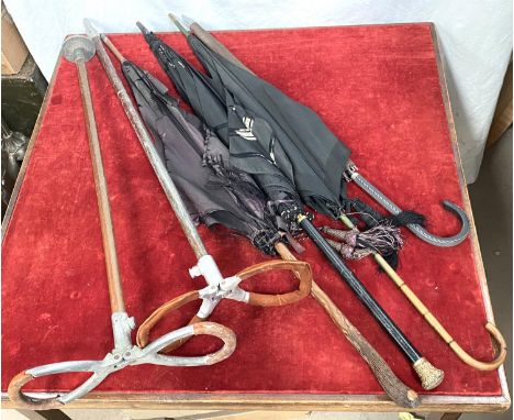 A gilt tipped parasol, other parasols, two vintage shooting sticks etc 
