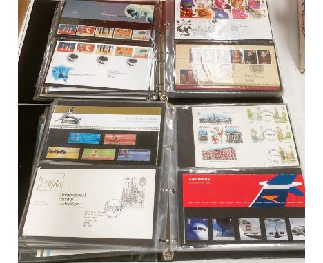 A collection of GB stamps in four ring binders, presentation packs, first day covers etc 